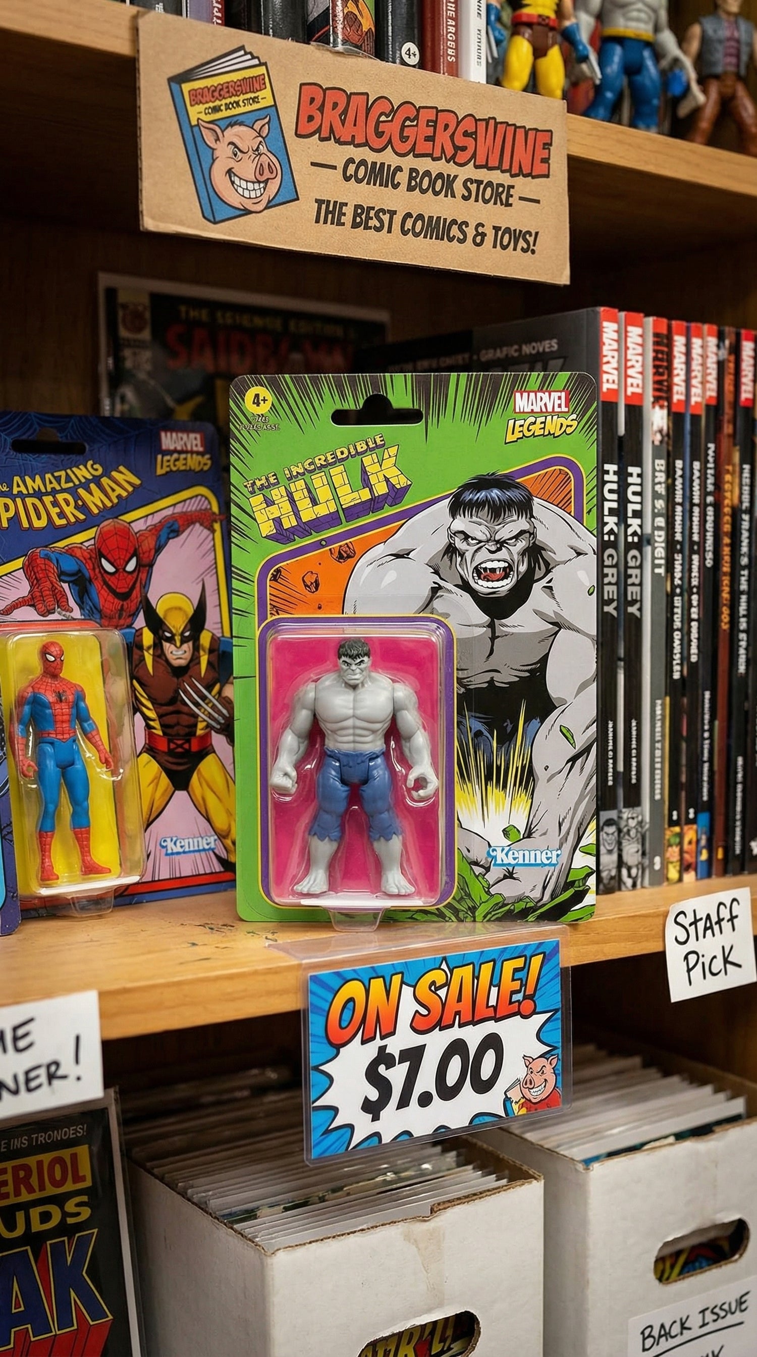Toy store display with action figures, comic books, and promotional signs.